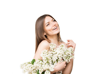Cute beautiful young woman with white lilac flowers covers her bare shoulders