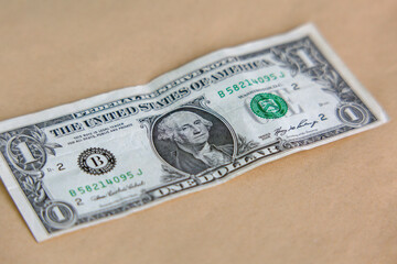 USA dollar on craft background: one currency banknote. Inflation, business, economics and finance...