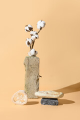 Balance composition with natural SPA materials with stand and podium of stone, cotton flowers....