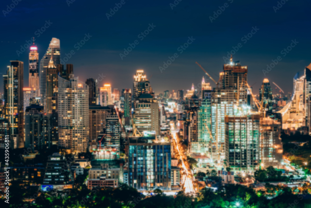 Poster abstract blurred city lights and building with a circular bokeh on blue background.
