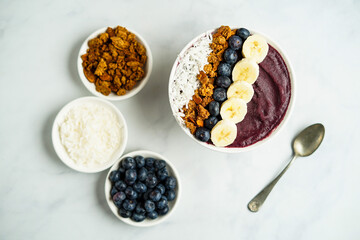 Blueberry smoothie bowl with granola and fresh fruit