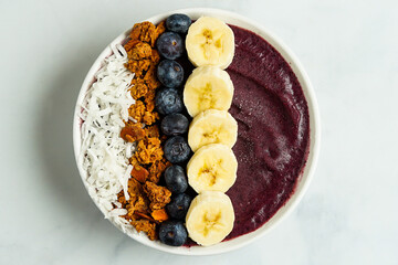 Blueberry smoothie bowl with granola and fresh fruit