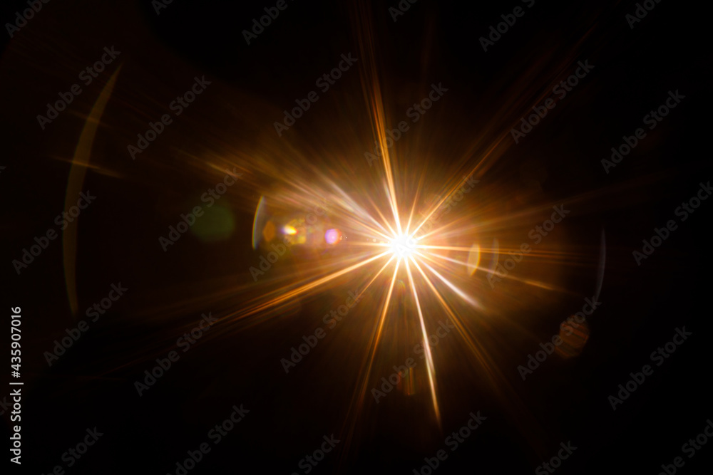 Poster Easy to add lens flare effects for overlay designs or screen blending mode to make high-quality images. Abstract sun burst, digital flare, iridescent glare over black background.