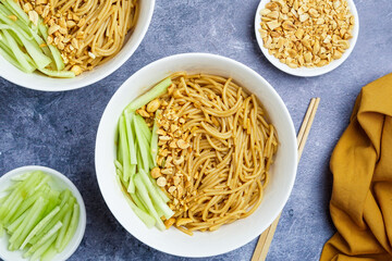 Sesame noodles with chopped peanuts and fresh cucumber