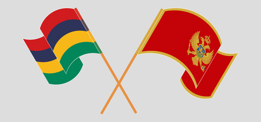 Crossed and waving flags of Mauritius and Montenegro