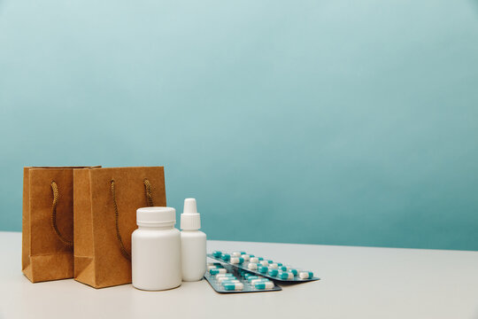 Bags with medical white containers and pills, online shopping theme