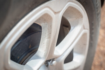 Fototapeta na wymiar Dirty car wheel before washing.