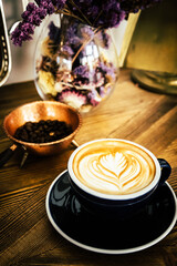 Coffee cup and beans on old vintage table. Top view with copy space for your text into the background.	
