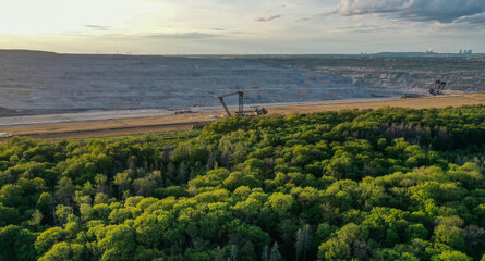 Fototapeta na wymiar Aerial view of the Hambacher Forest and in the background the nearby open pit Hambach