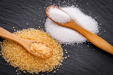 cane brown sugar on a dark stone background