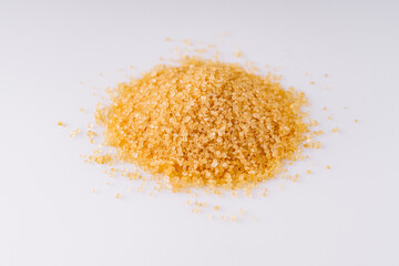 cane brown sugar on a white acrylic background