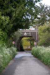 English country lane with railroad bridge