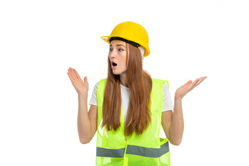 Young beautiful woman with red hair in helmet at studio