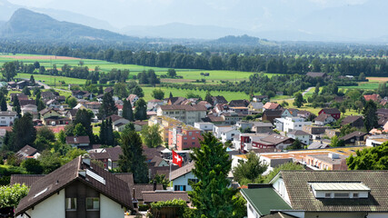 Fototapeta na wymiar Schweiz, Landschaft, Dorf, Flagge (Kanton St. Gallen)