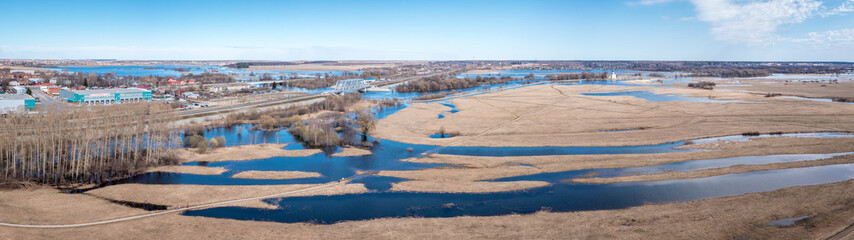 Aerial panorama of the city of Vladimir and fields with the flooded rivers Klyazma and Nerl. Spring landscape.