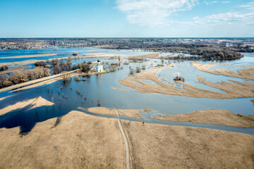 Spring flood of the river into the fields. The Church of the Intercession on the Nerl River...