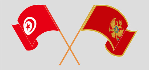 Crossed and waving flags of Tunisia and Montenegro