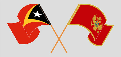 Crossed and waving flags of East Timor and Montenegro