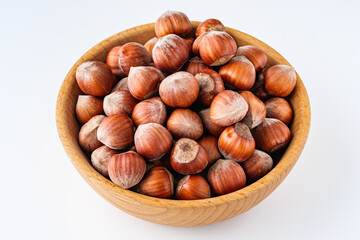 fresh natural hazelnuts on a white acrylic background