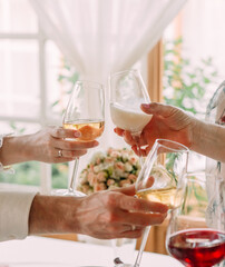festive toast glasses together group people cocktails
