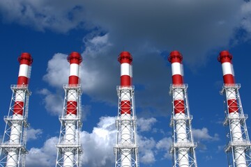 Red and white boiler room pipes against the sky