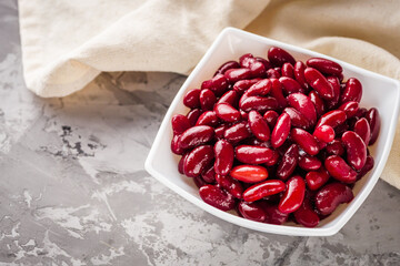 canned red kidney beans on a dark stone rustic background