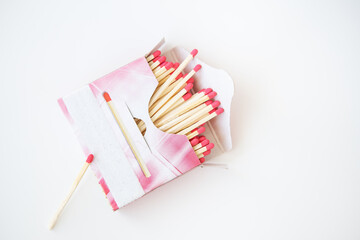 Long matches with a red head on a white background. Kitchen, ignition, gas, matchbox, flammable.