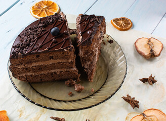 slice of chocolate cake with blueberries on top on gray background. top view.