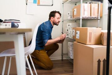 Hardworking man getting shipping information