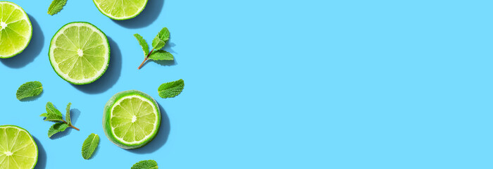 Fresh green limes with mints overhead view