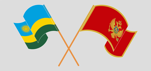 Crossed and waving flags of Rwanda and Montenegro