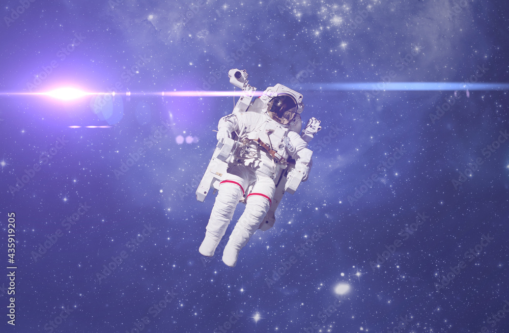 Poster cosmonaut fly in the outer space with stars and galaxy background with a light beam. elements of thi