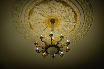 Old antique chandelier in the hall.