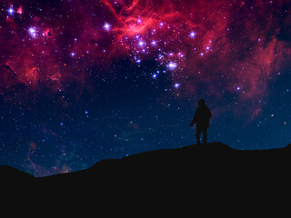 Fototapeta na wymiar silhouette of a person standing on top of mountain and watch the sky galaxy. elements of this image furnished by nasa