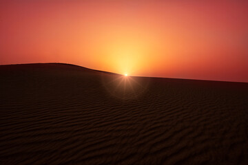 Desert morning sunrise with sand pattern and sun shine