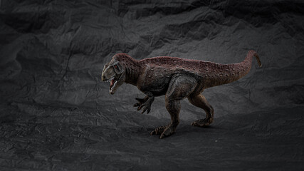 toy dinosaurs, little model, on dark background