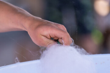 Making cotton candy from sugar.
