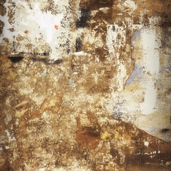 Scratched Advertising On Grunge Wall Background. Exposed Weathered Urban Wall with Torn Street Posters, Paper and Stickers. Old Billboard with Torn Posters. Vintage Frame Background and Texture.