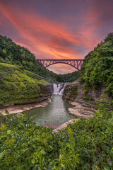 Letchworth state waterfall and bridge at sunset