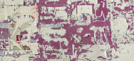 Grunge Wide Background with Old Torn Posters. Urban Graffiti Wall Texture. Grungy Ripped Wall with Torn Posters and Ads Background. Panoramic Urban Wallpaper. Graffiti Wall Texture.