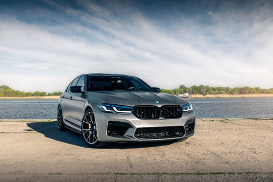 New BMW M5 F90 Competition on the background of the river. Kherson, Ukraine - May 2021.