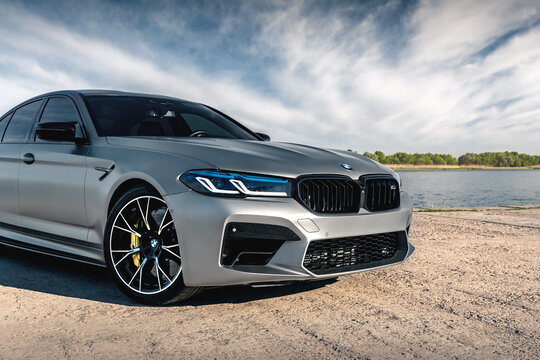 New BMW M5 F90 Competition on the background of the river. Kherson, Ukraine - May 2021.
