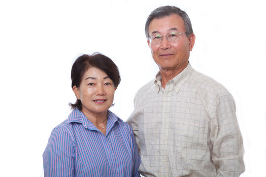 Japanese senior couple smiling at the camera