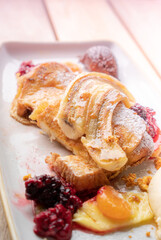 Delicious Brunch of French Toast with Caramelised Banana and Berries, Selective Focus