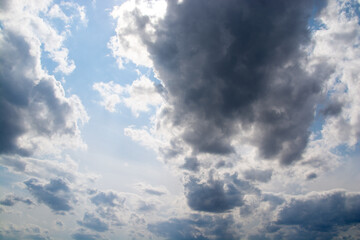 dark clouds in a blue sky close-up.