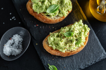 Tasty fresh toast with mashed avocado