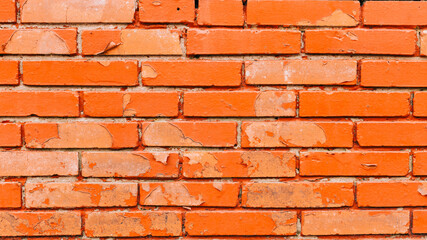 damaged brick background with an orange color