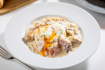 Carbonara pasta with poached egg