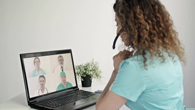 Group video conference of medicine workers share ideas remotely.