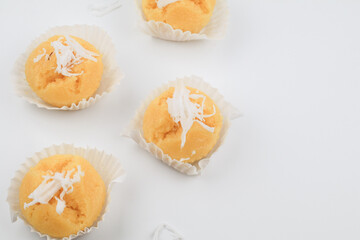 Toddy Palm Cake with coconut (Kanom Tarn) made from rice flour, palm oil, sugar and salt on white background, Thai dessert sweet taste delicious.